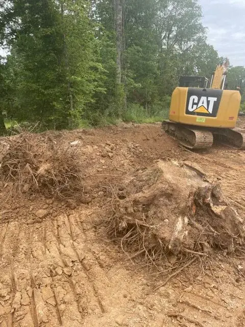 Dirt work contractor grading property for drainage — Leflore County MS