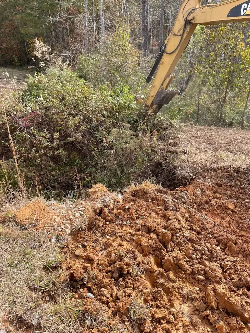 Excavation equipment grading a large residential lot — Rankin County, MS