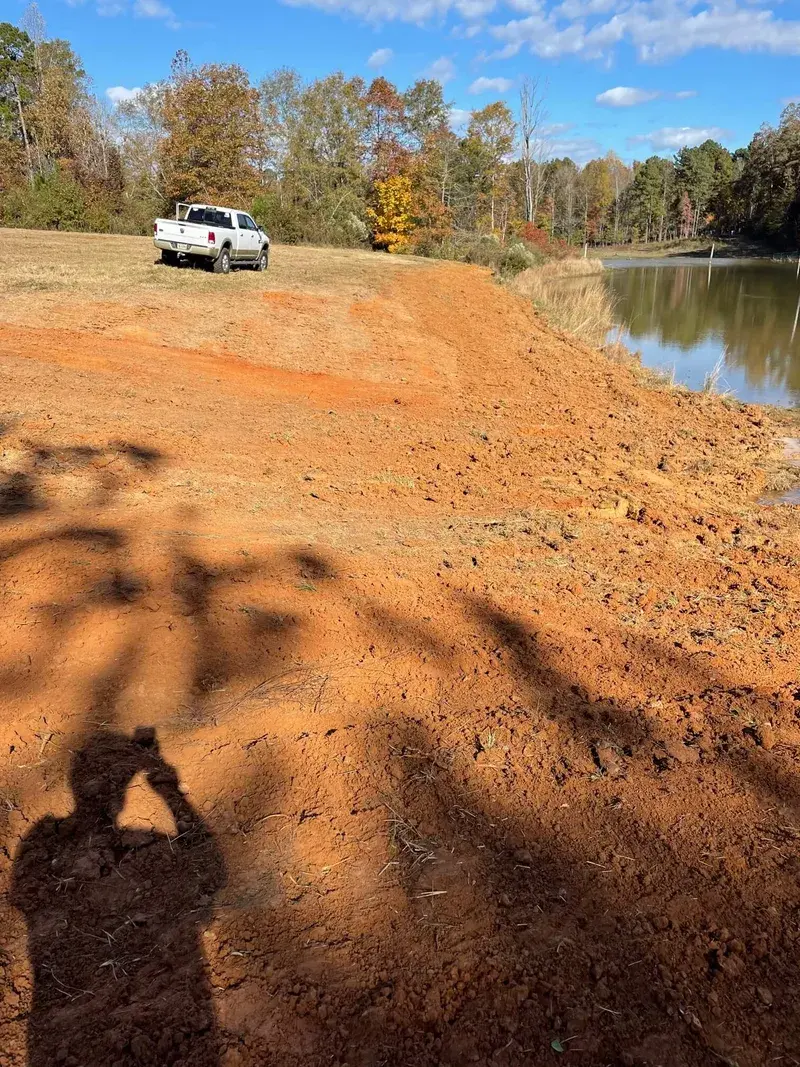 Completed pond construction with clear water — Madison County, Mississippi