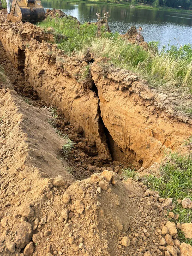 Excavator on job site — residential site preparation in Yazoo County, MS