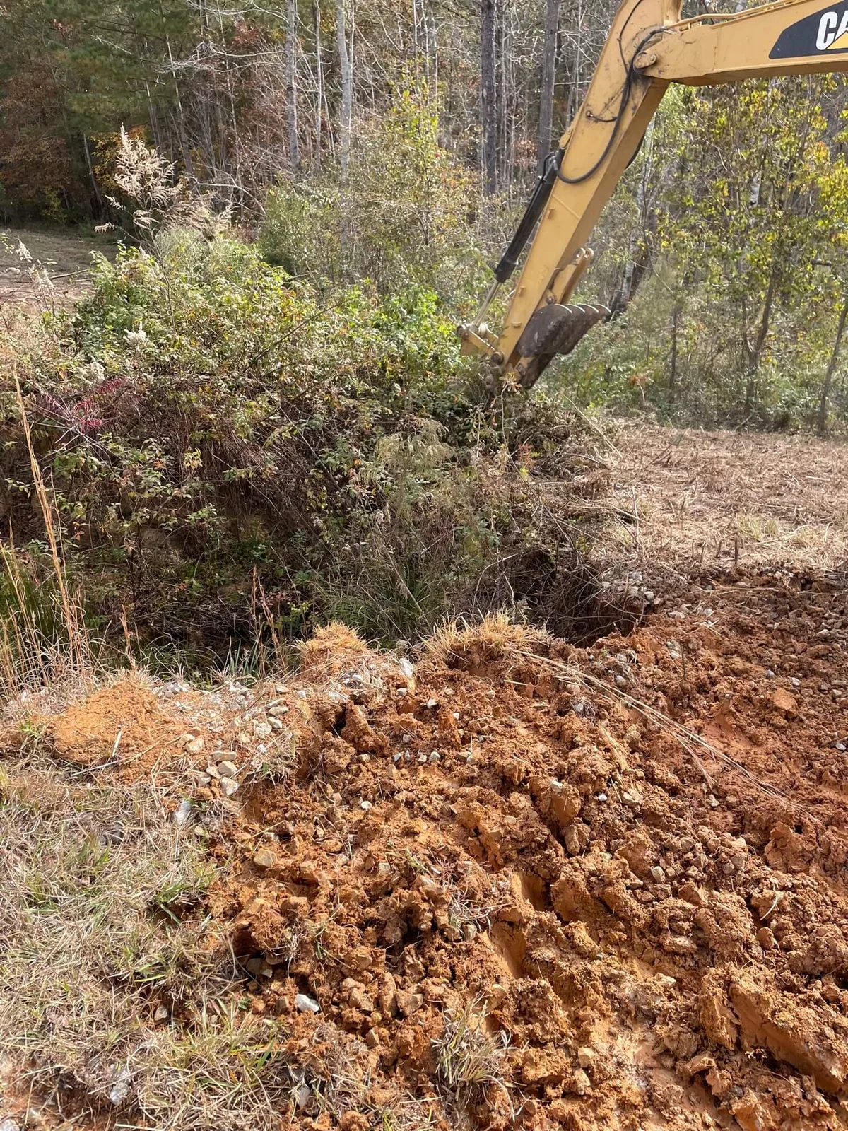 Geaux Pro Outdoors excavator grading land in Brandon, MS — family-owned excavation contractor serving Central Mississippi